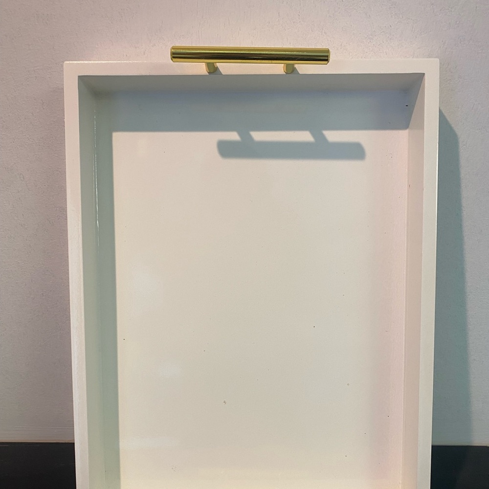 White decorative tray with gold handles